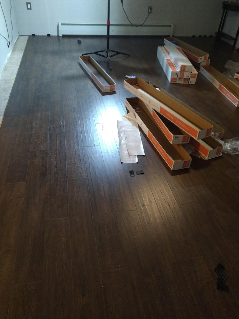 Completed section of dark laminate flooring