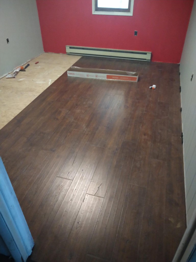 Room mid-way through laminate floor installation